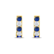 Kolié 9ct Yellow Gold Huggie Earrings with Sapphire Blue Zirconia - Kolié