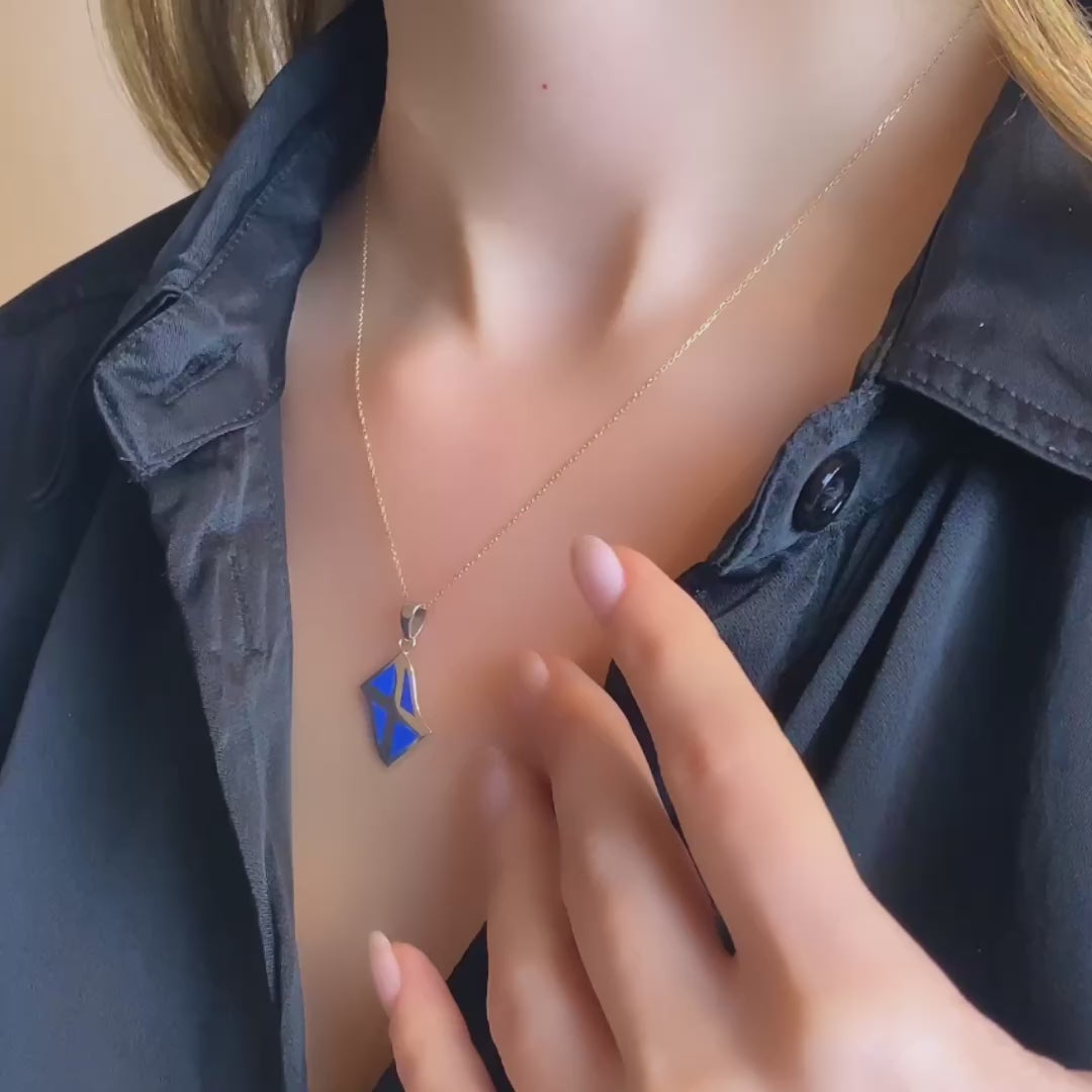 The video of the pendant displayed on a delicate white gold chain, on a model (for reference only, chain not included)