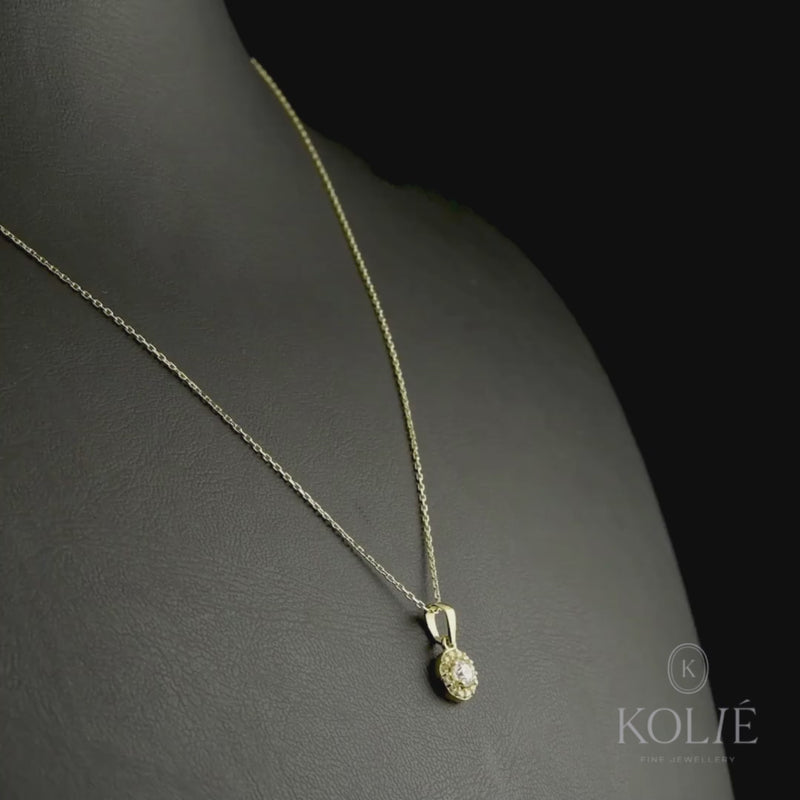 Kolié 9ct yellow gold necklace with halo pendant with a central cubic zirconia surrounded by smaller stones.