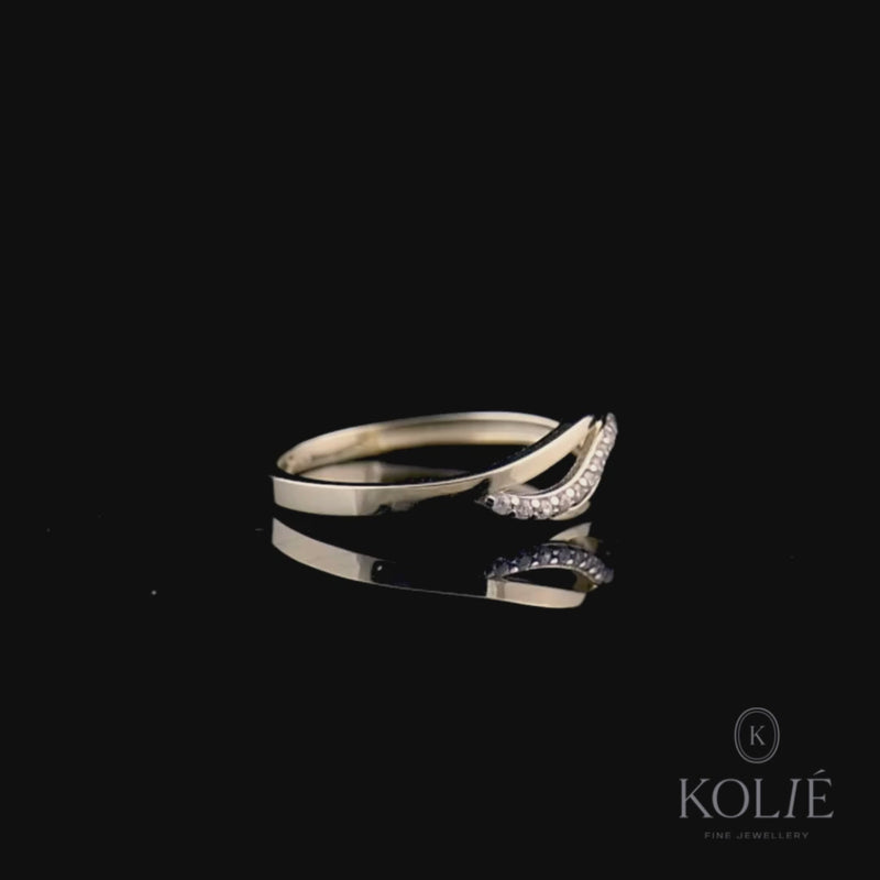 Stylish Kolié 9ct yellow gold ring showcasing a crossover design with a band of shimmering cubic zirconia