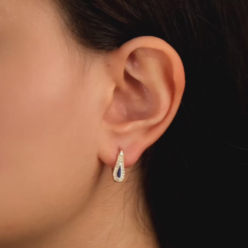 View of the earrings to highlight the secure hinged closure and teardrop shape