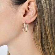 Close-up of Kolié 9ct solid gold textured square hoop earrings, featuring a unique square shape and a subtle textured finish.