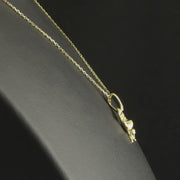 Video of 14ct solid gold duck pendant displayed on black background