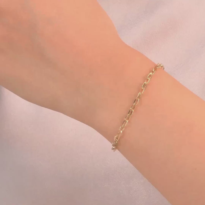 The bracelet worn on a wrist, showing the elegant and versatile design.